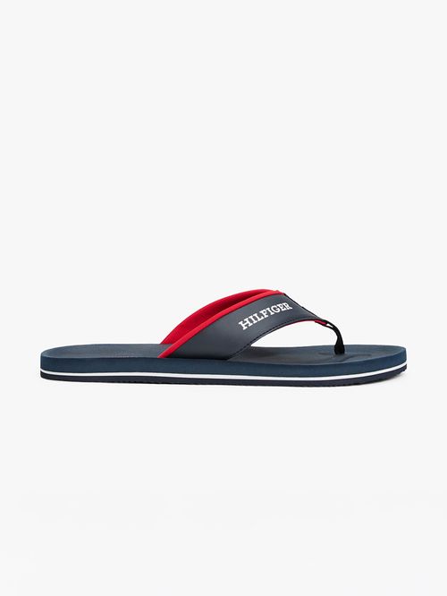 ZAPATILLAS CON TIRAS ACOLCHADAS E INSCRIPCIÓN