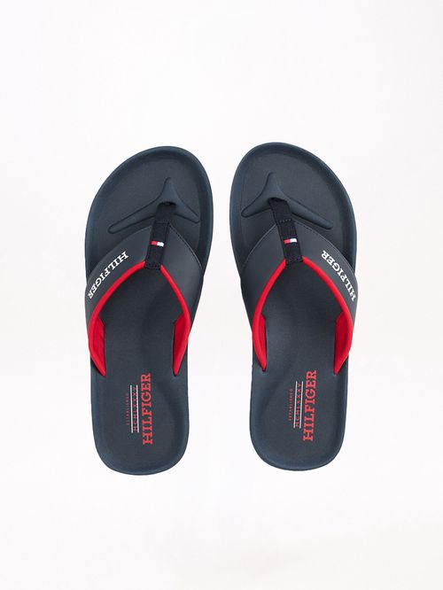 ZAPATILLAS CON TIRAS ACOLCHADAS E INSCRIPCIÓN