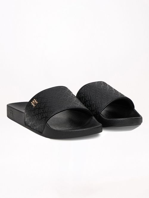 ZAPATILLAS CON MONOGRAMAS TH EN RELIEVE