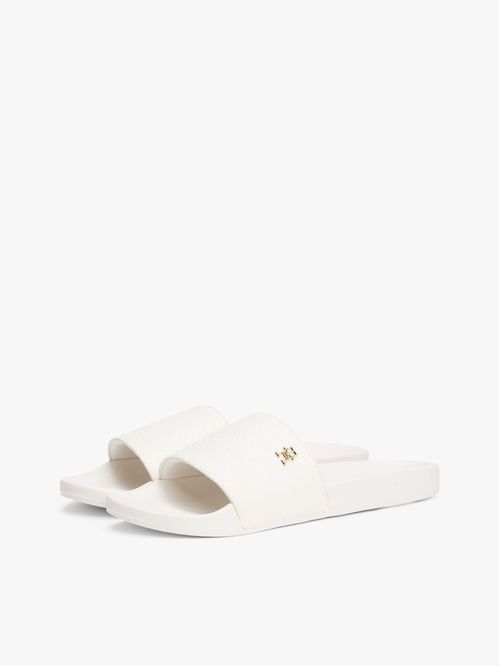 ZAPATILLAS CON MONOGRAMAS TH EN RELIEVE